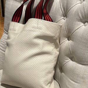 Clare V Carryall Tote in White Perforated leather with black and red handles